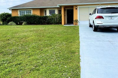 Exterior view of a building with a driveway.
