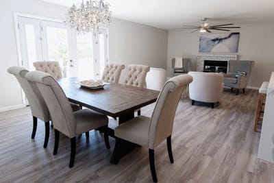 Elegant common area with dining table and seating.