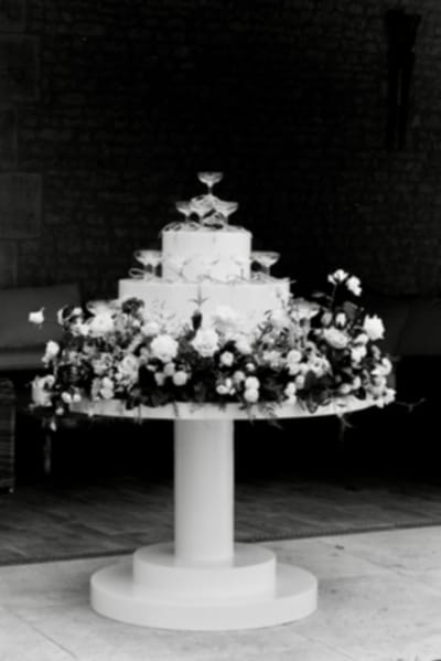Elegant wedding cake with floral decorations.