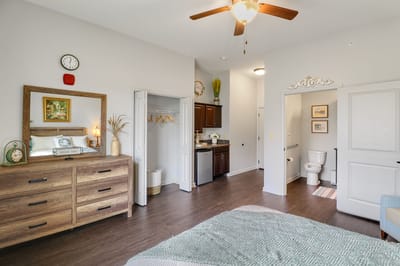 Cozy bedroom with modern furnishings and decor.