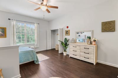 Well-furnished resident room with natural light