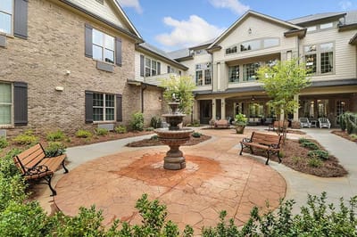 Outdoor courtyard with a fountain and seating