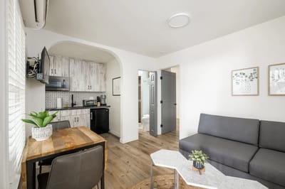 Updated kitchenette and living area in a residence.
