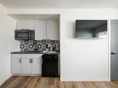 Modern kitchenette in a bright interior space.