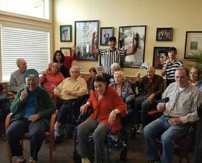 Residents engaging in a group activity in a common area.