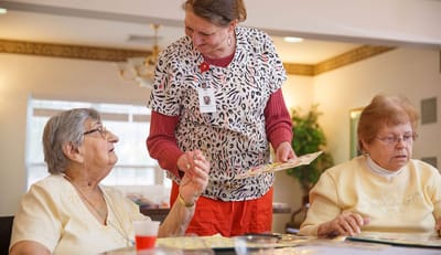 Staff engaging with residents during an activity.