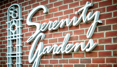Facility name on exterior wall in elegant lettering.