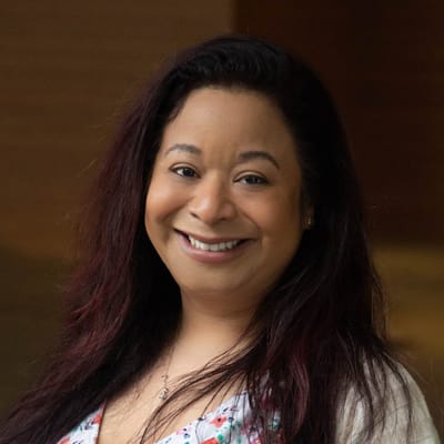 Smiling staff member in a close-up portrait.