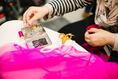Close-up of a person sewing fabric