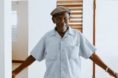 Smiling elderly man in a common area