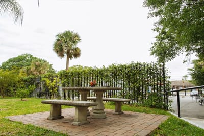 Outdoor seating area with a table and benches