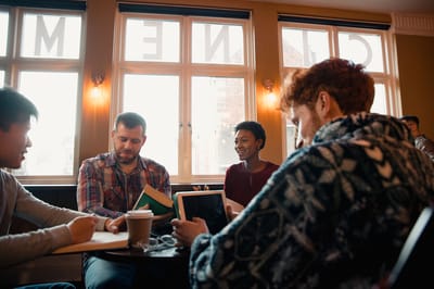 Residents engaging in conversation at a table