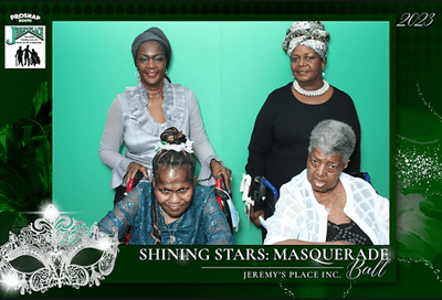 Residents and staff at a masquerade ball.