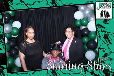 Residents celebrating with balloons at an event.