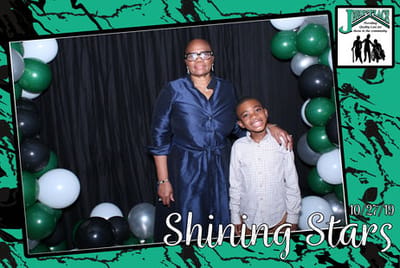 Two people posing together at an event