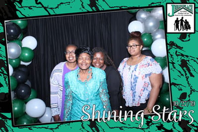 Group of women posing for a photo at an event