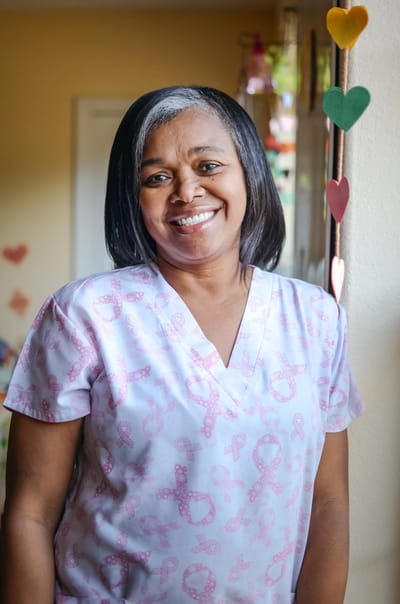 Staff member smiling in a care facility