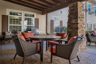 Outdoor seating area with table and chairs