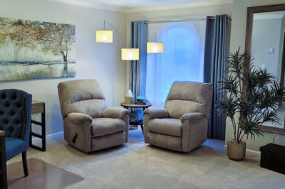 Cozy living area with recliners and decor