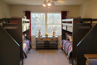 Bunk beds in a cozy resident room with natural light.