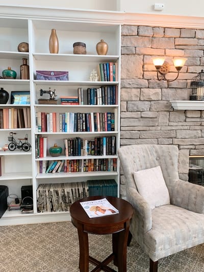 Cozy reading area with bookshelves and a chair