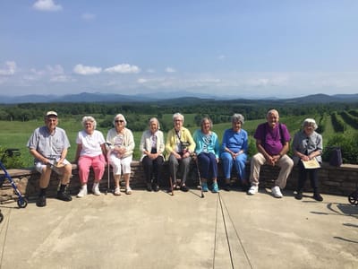 Group of residents enjoying the outdoor view.