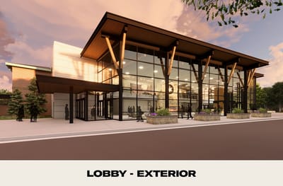 Exterior view of the facility's lobby with landscaping.