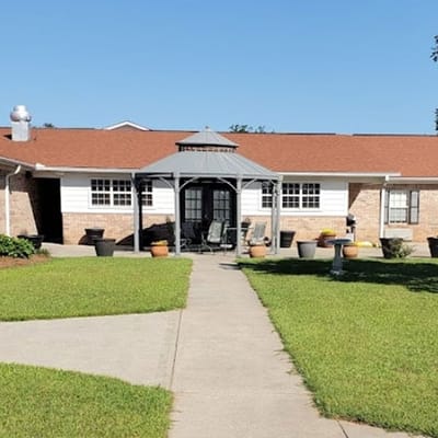 Exterior view of the facility with outdoor seating area.