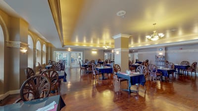 Dining room with tables and chairs set up
