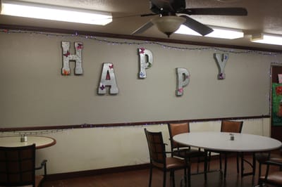 Common area decorated with 'HAPPY' letters
