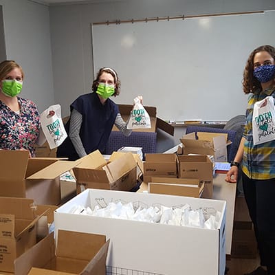 Staff preparing care packages in an interior space