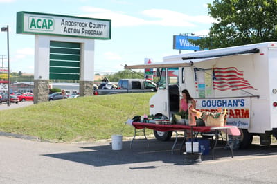 Farmer's market stall outside a facility