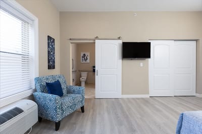 Bright and spacious resident room with seating