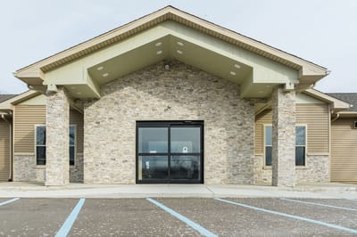 Exterior view of a assisted living facility entrance.
