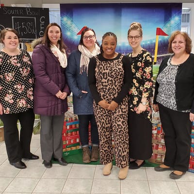 Group of staff members celebrating an event.
