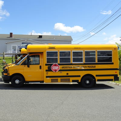 Yellow bus labeled for Aroostook County Action Program