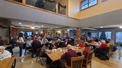 Residents enjoying a meal in the dining area.