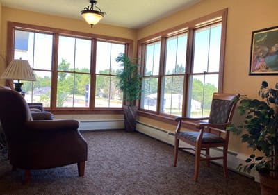 Cozy social area with large windows and seating