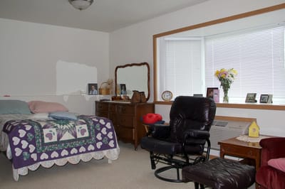 Cozy resident room with furniture and decor