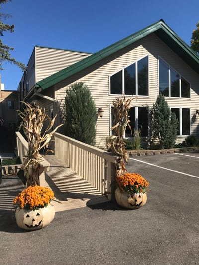 Exterior view of the facility with fall decorations.