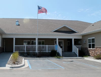 Exterior of Cornerstone Residence with American flag