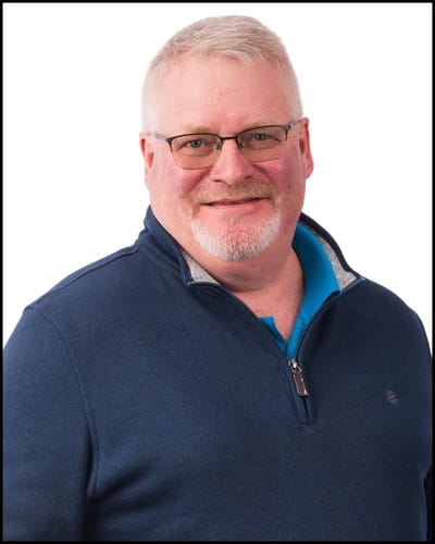 Smiling man in a blue sweater