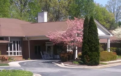 Exterior view of the facility with blooming trees