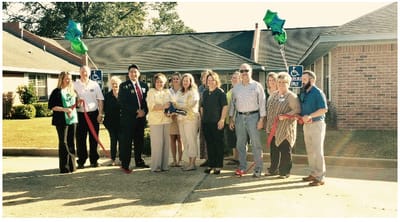 Ribbon-cutting ceremony with staff and community members.