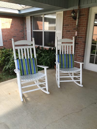 Two rocking chairs on a covered porch