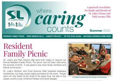 Residents and staff enjoying a family picnic