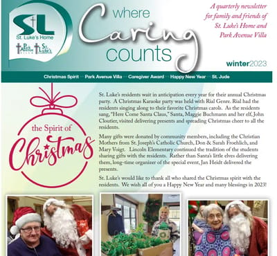 Residents celebrating Christmas with festive hats.