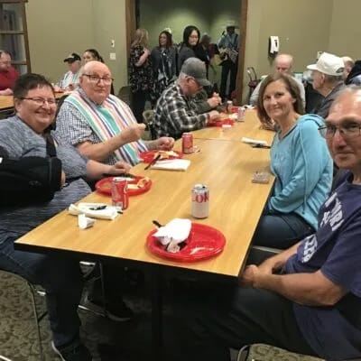 Residents enjoying a meal together in a common area.