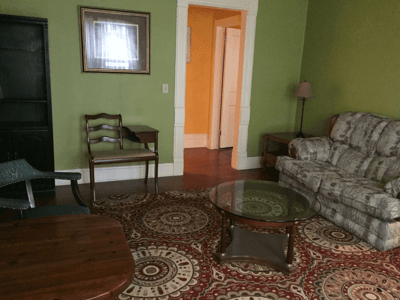 Cozy common area with seating and rug