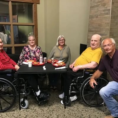 Residents and staff enjoying food together